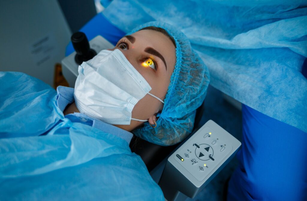 A light shines on a young patient's pupil during the LASIK procedure.