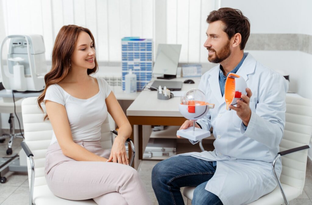 A young patient discusses her candidacy for LASIK surgery with her optometrist.