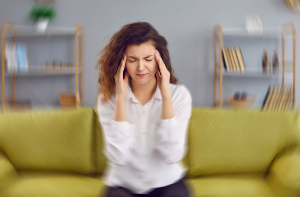 A person feels motion sickness from untreated BVD.